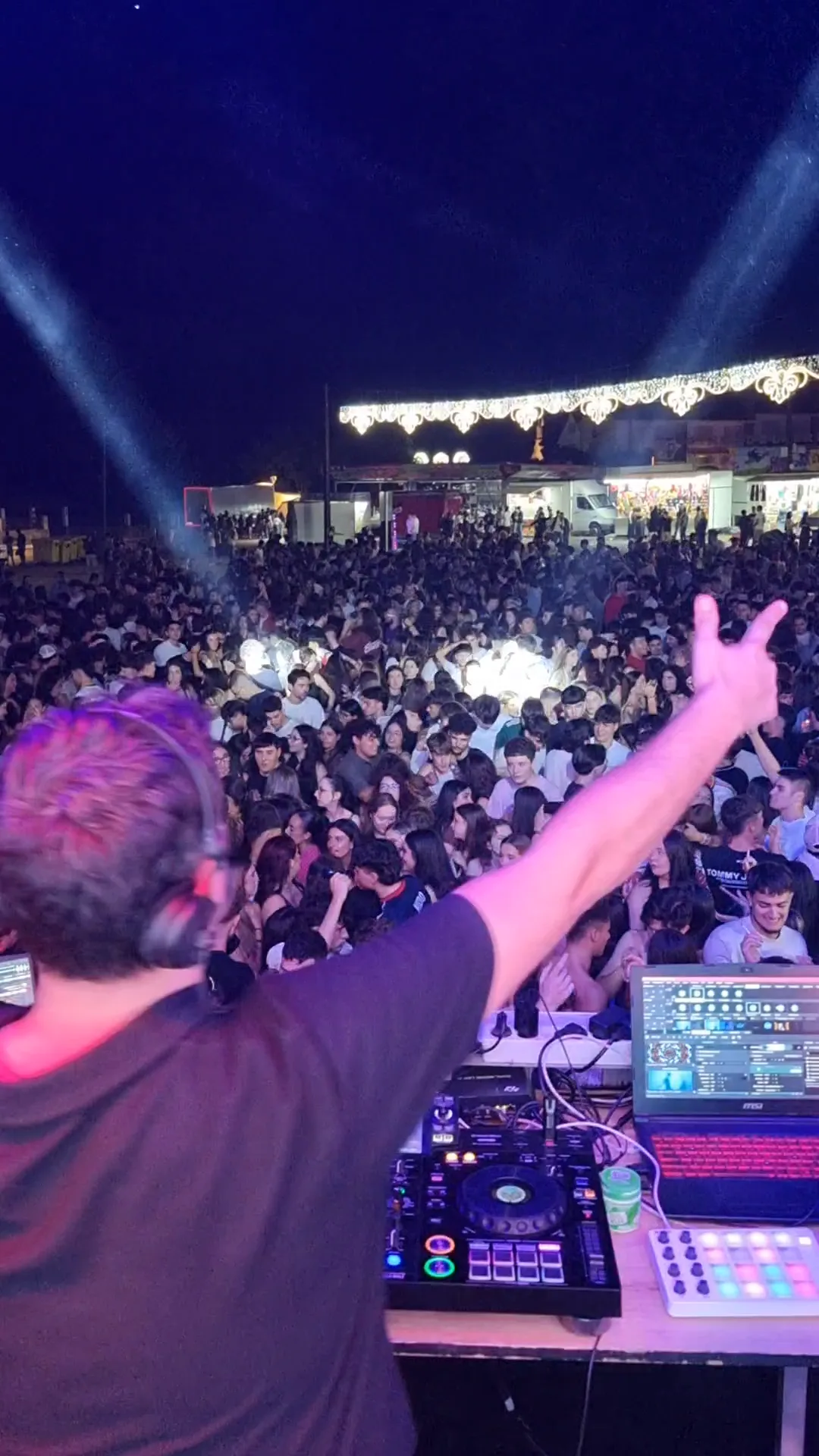 Night crowd seen from IWARO’s booth