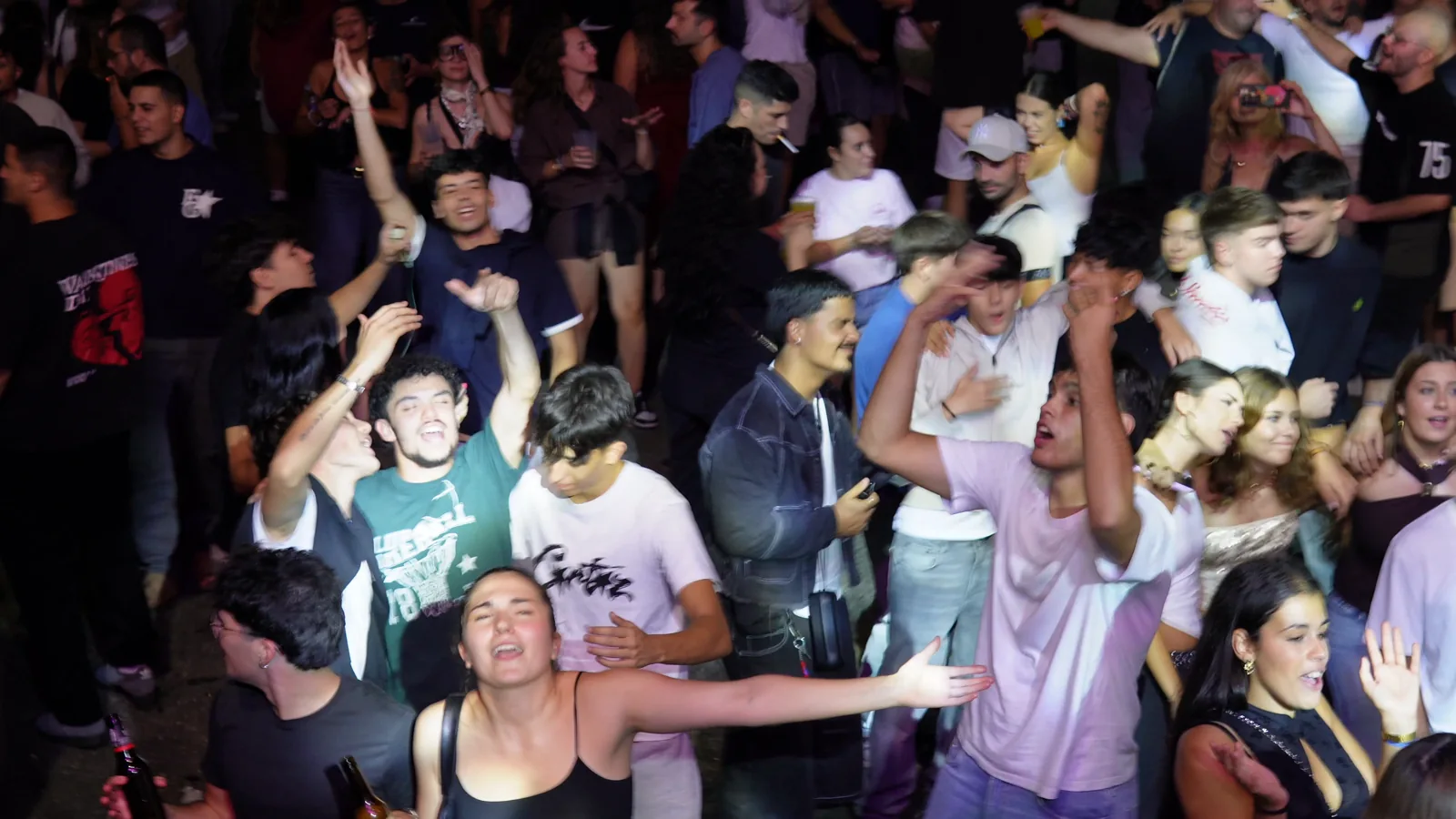 Dancers with their arms raised
